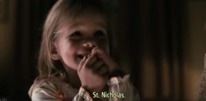 A little girl is excited for the arrival of Saint Nick
