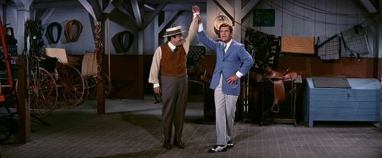 Buddy Hackett and Robert Preston dance in The Music Man.
